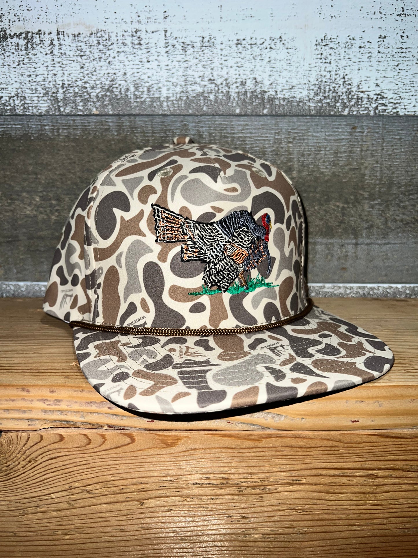camo hat with strut turkey